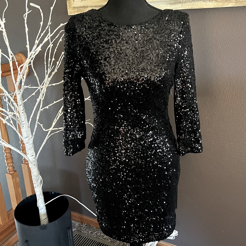 Eligant black sequin cocktail dress by Tobi .